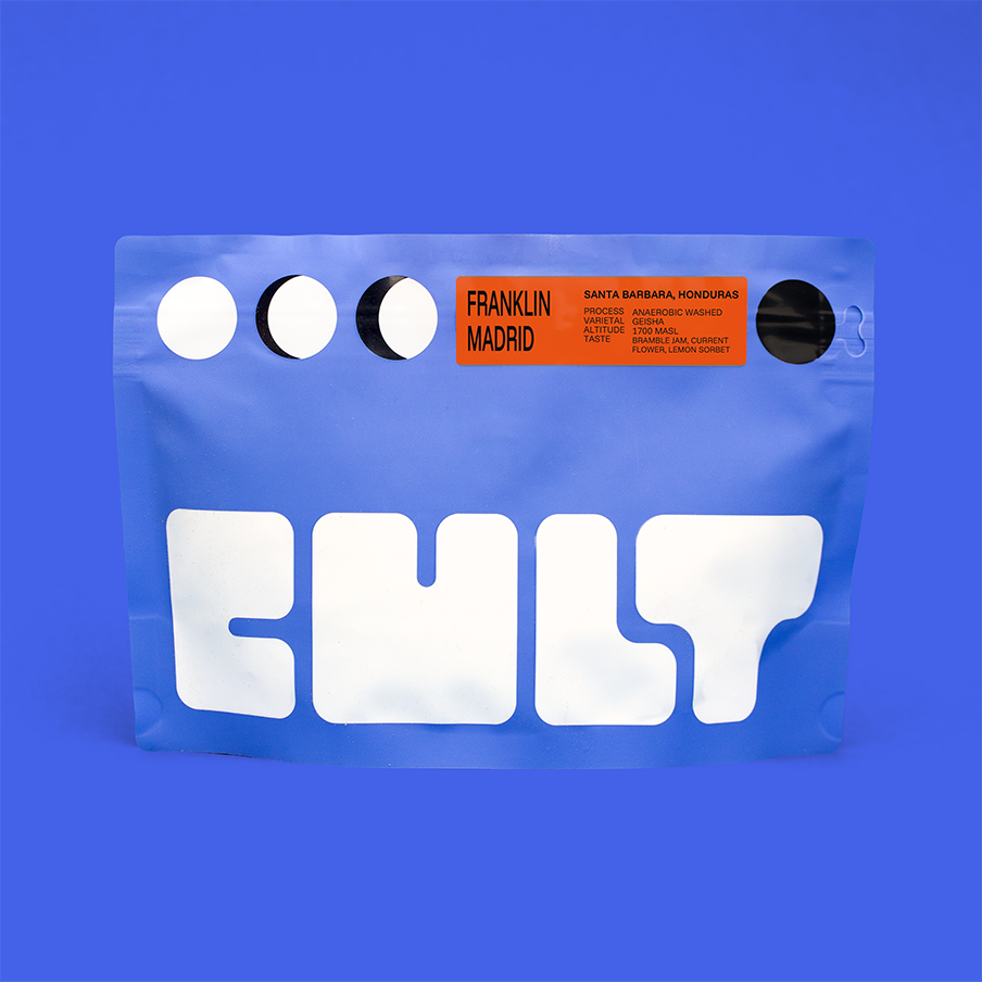 Blue coffee packaging with 'CULT' branding on a blue background. Label reads 'Franklin Madrid'. 