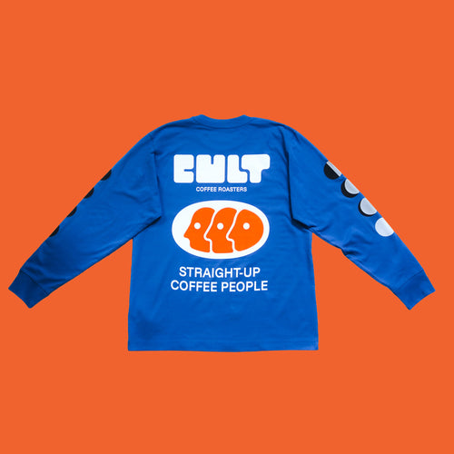 Blue long sleeve cult t-shirt on orange background, back view. White and orange logo covers the back with the phrase 'Straight-Up Coffee People'. 