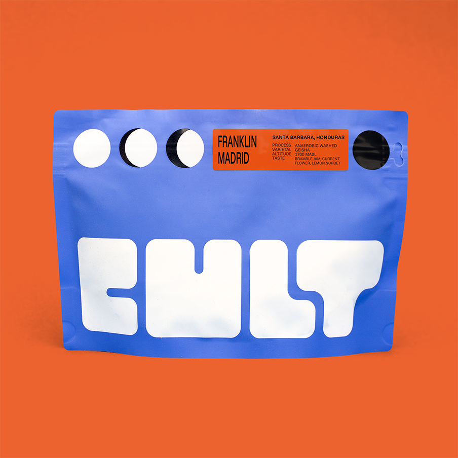 Blue coffee packaging with 'CULT' branding on an orange background. Orange label reads ' Franklin Madrid'. 